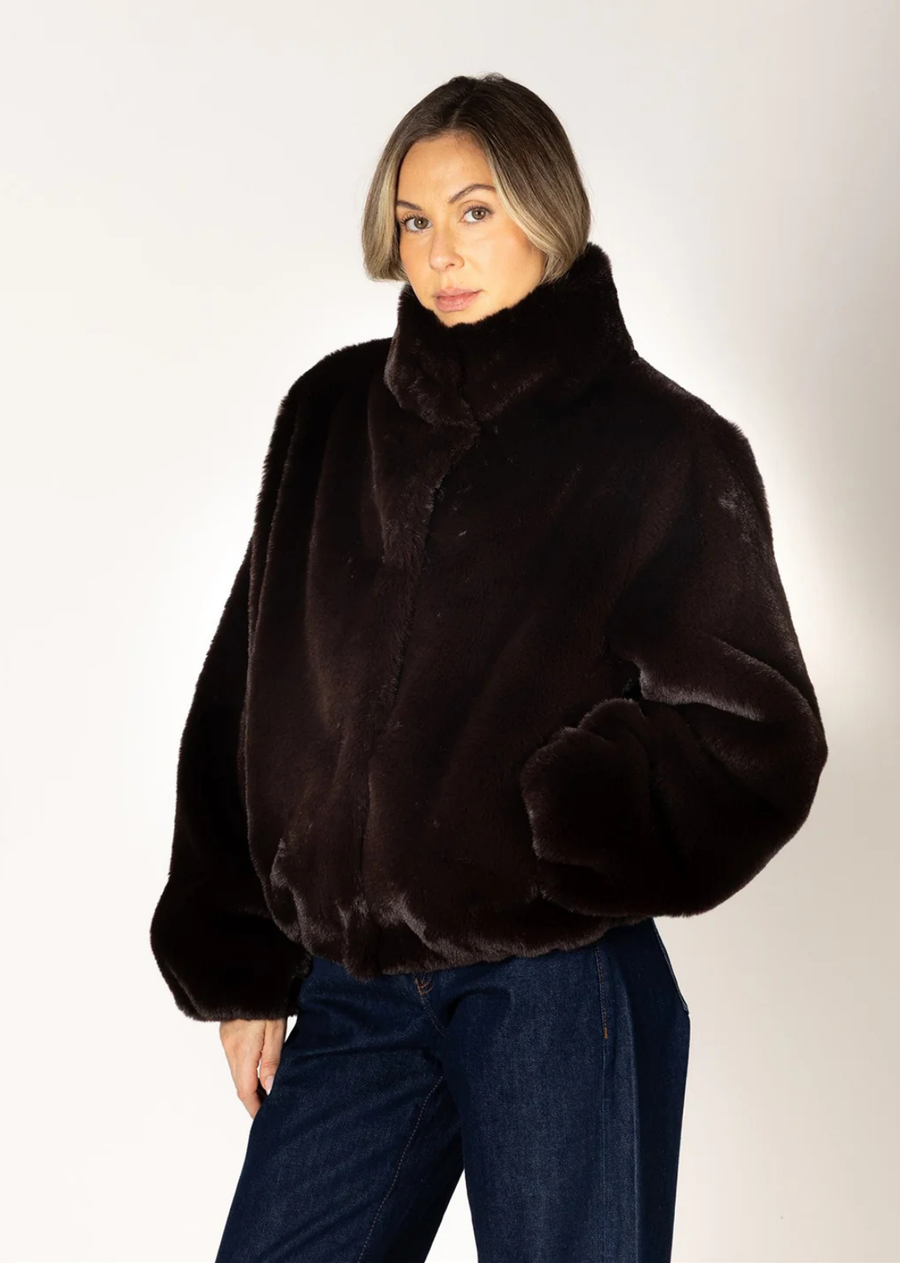 Rich espresso brown faux fur coat with a relaxed fit, long sleeves, crew neckline, and front button closure.
