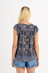 Molly Bracken Printed Top. Viscose top with geometric pattern, ruffled shoulder and front tie.