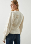  The ultimate transition sweater, Romy is warm and cozy with a touch of detailing. Made from a soft cotton blend and complete with crocheted daisies throughout.