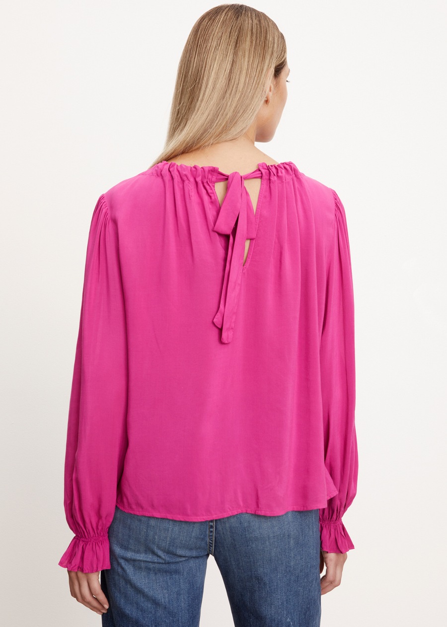 Velvet Bristol Challis LS Top Our luxurious rayon challis fabric gives this top an elegant structure. A unique tie closure at the rear neckline creates an effortless gathered effect, while the elastic cuffs add subtle detail.