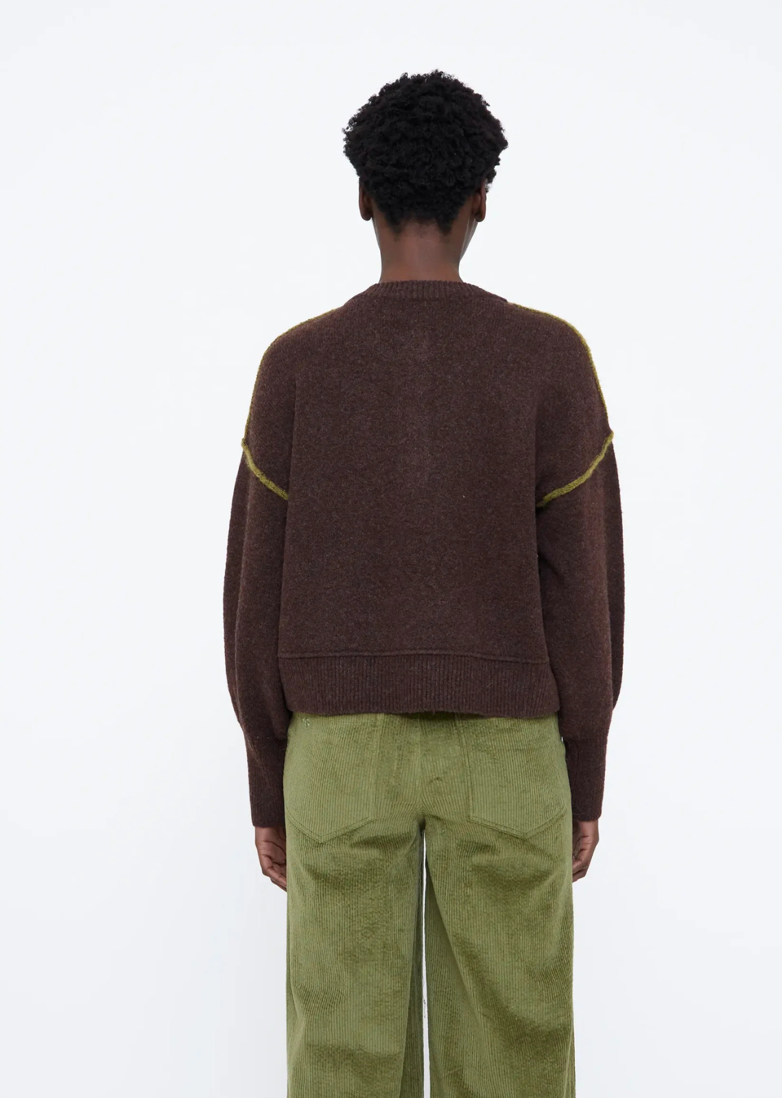 Brown wool-blend knit sweater with a round neckline, long sleeves, slightly dropped shoulders, two-tone front buttons, green details, and ribbed trims.