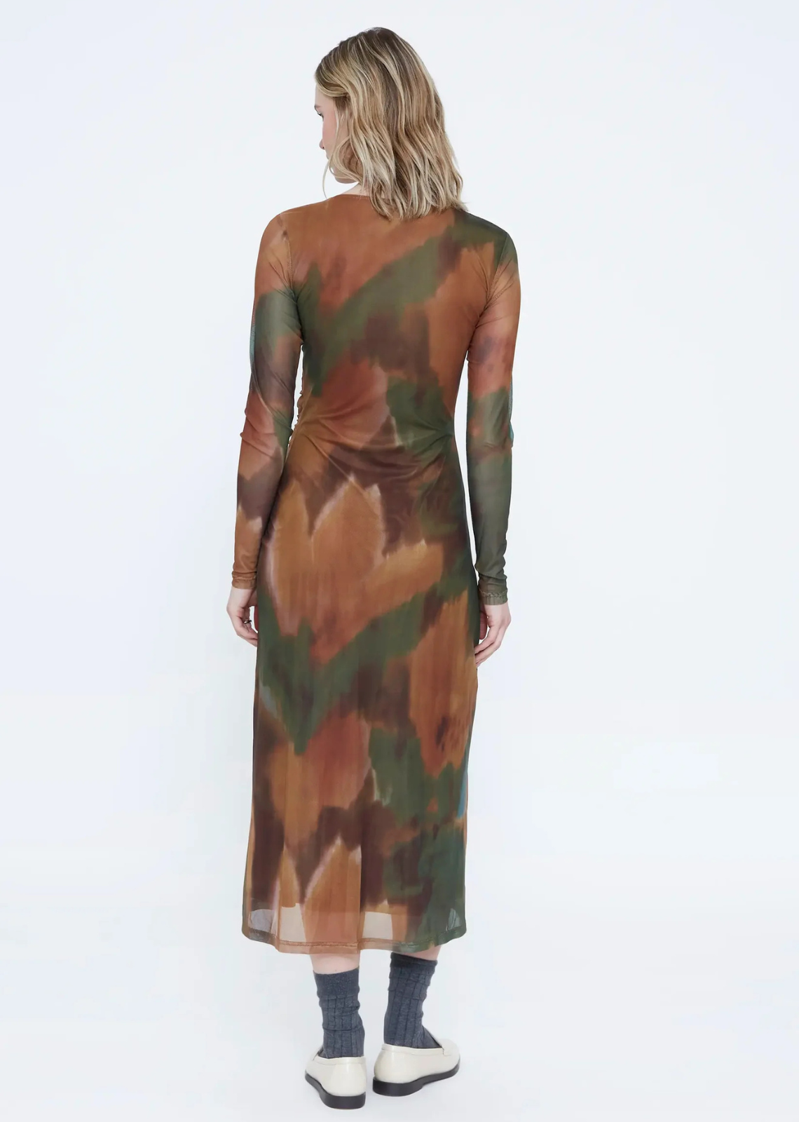 Maple print mesh maxi dress with a round neckline, long sleeves, adjustable elastic waistband, side slit, and inner lining.