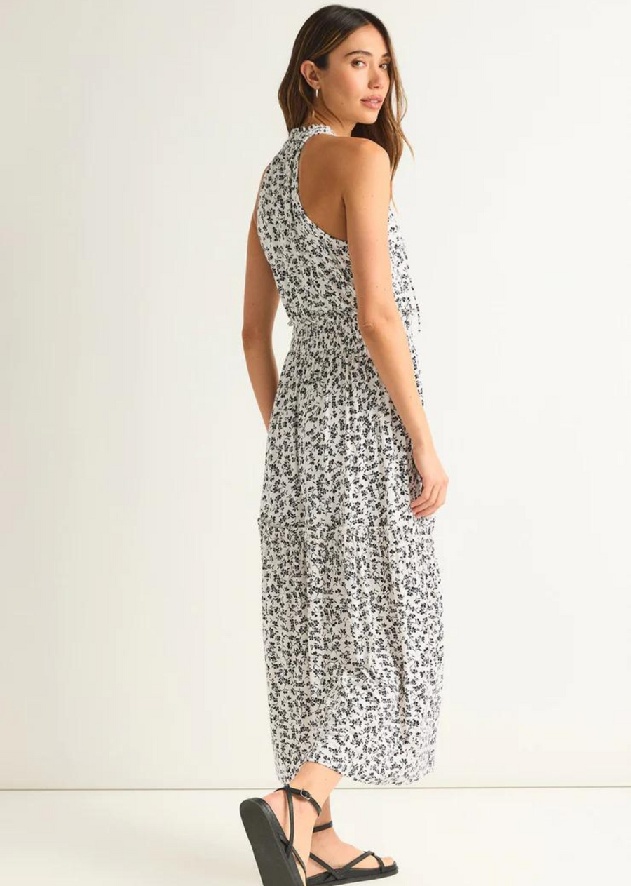 Z Supply Rhea Gia Ditsy Midi Dress The Rhea Gia Ditsy Midi Dress is the perfect sundress. While our all black version is perfect for a night out, this feminine ditsy dress will easily become your daily go-to, this season and the next.