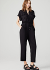 Steve Madden Alya Jumpsuit. Introducing the ALYA jumpsuit. This modal jumpsuit features a button front and elastic waist for a comfortable fit. It's tapered ankle length and short sleeves make it perfect for spring.