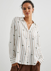 Rails Charli Shirt- Stripe Palms. The Charli Shirt is a breezy take on the classic button-down. Made of a lightweight linen blend, white serves as the background of a palm tree pattern. It's designed and tailored for refinement, but can serve both laid back and office casual styles.